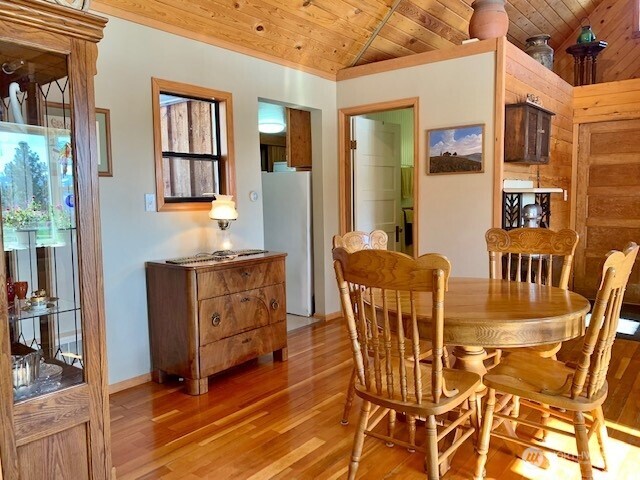 35 Low Ridge Road Malo, WA 99150 - Photo 4 of 40 a dining room with furniture a rug and wooden floor