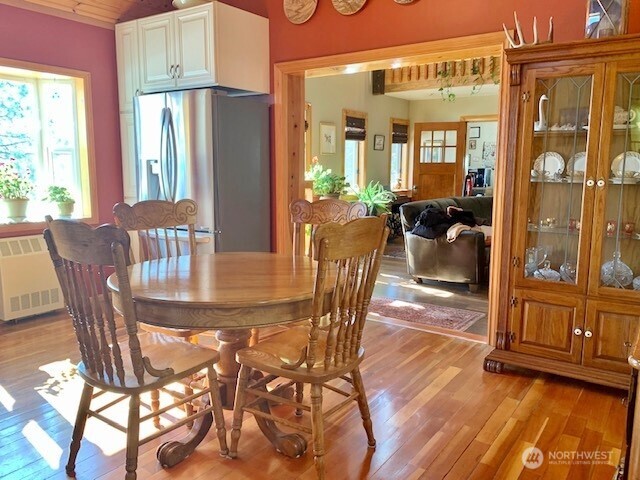 35 Low Ridge Road Malo, WA 99150 - Photo 7 of 40 a view of a dining room with furniture window and wooden floor