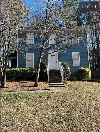a front view of a house with garage