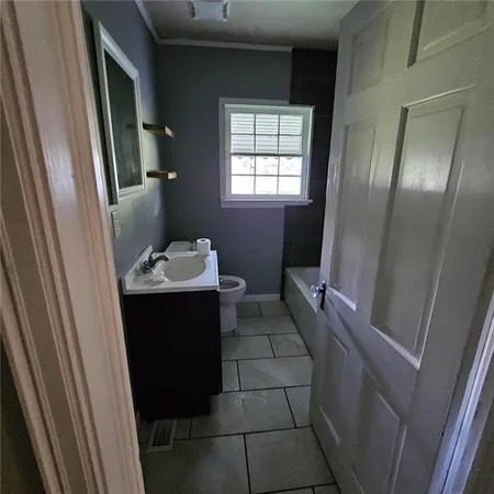 a bathroom with a sink and mirror