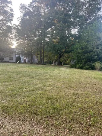 a view of outdoor space with trees all around