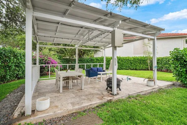 a view of outdoor space with palm trees
