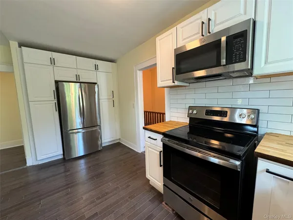 a kitchen with a stove and a microwave