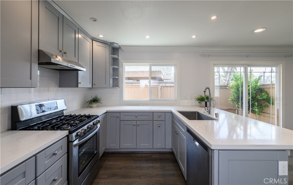 2 Hollowglen, Unit 7 Irvine, CA 92604 - Photo 12 of 31 a kitchen with a sink stove and cabinets