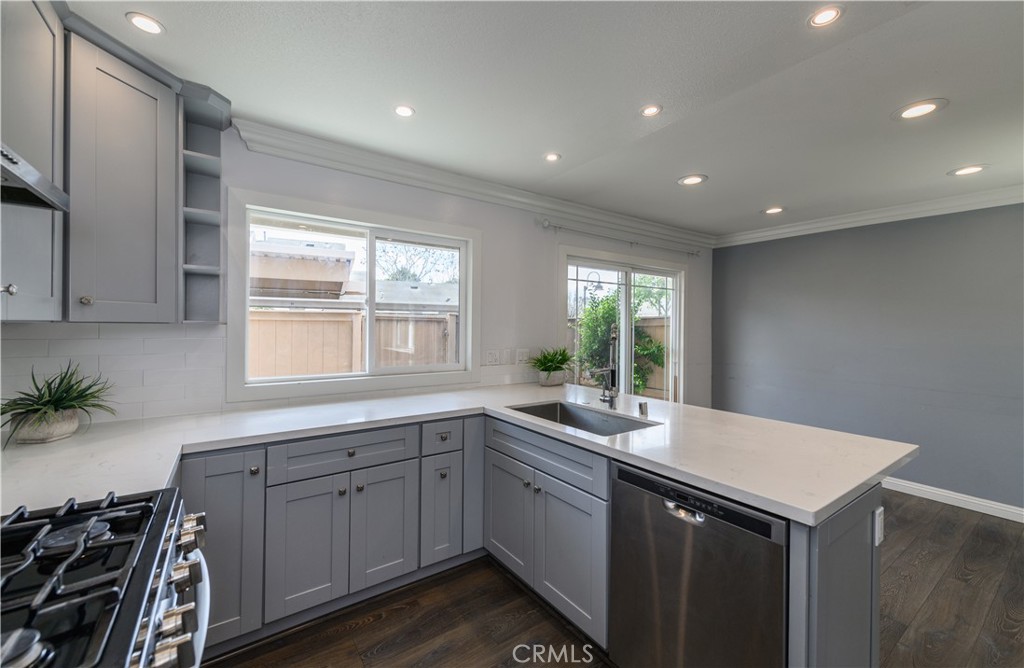 2 Hollowglen, Unit 7 Irvine, CA 92604 - Photo 13 of 31 a kitchen with sink and cabinets