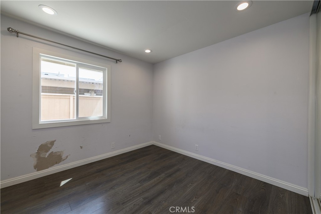 2 Hollowglen, Unit 7 Irvine, CA 92604 - Photo 18 of 31 a view of a room with wooden floor and windows