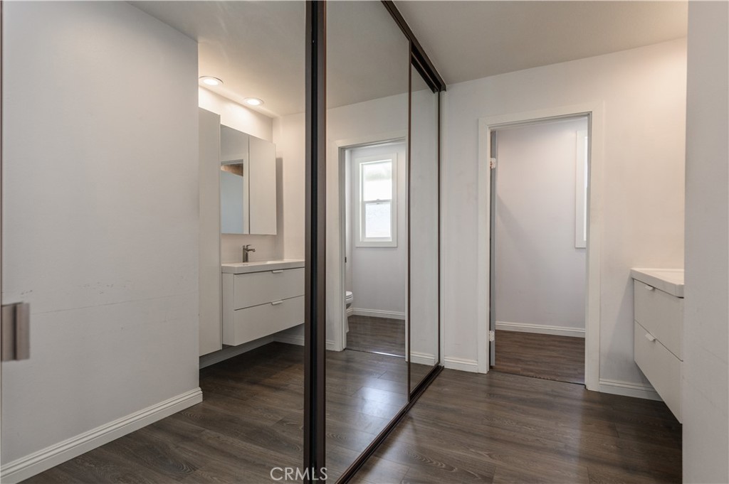 2 Hollowglen, Unit 7 Irvine, CA 92604 - Photo 23 of 31 an empty room with wooden floor & closet area