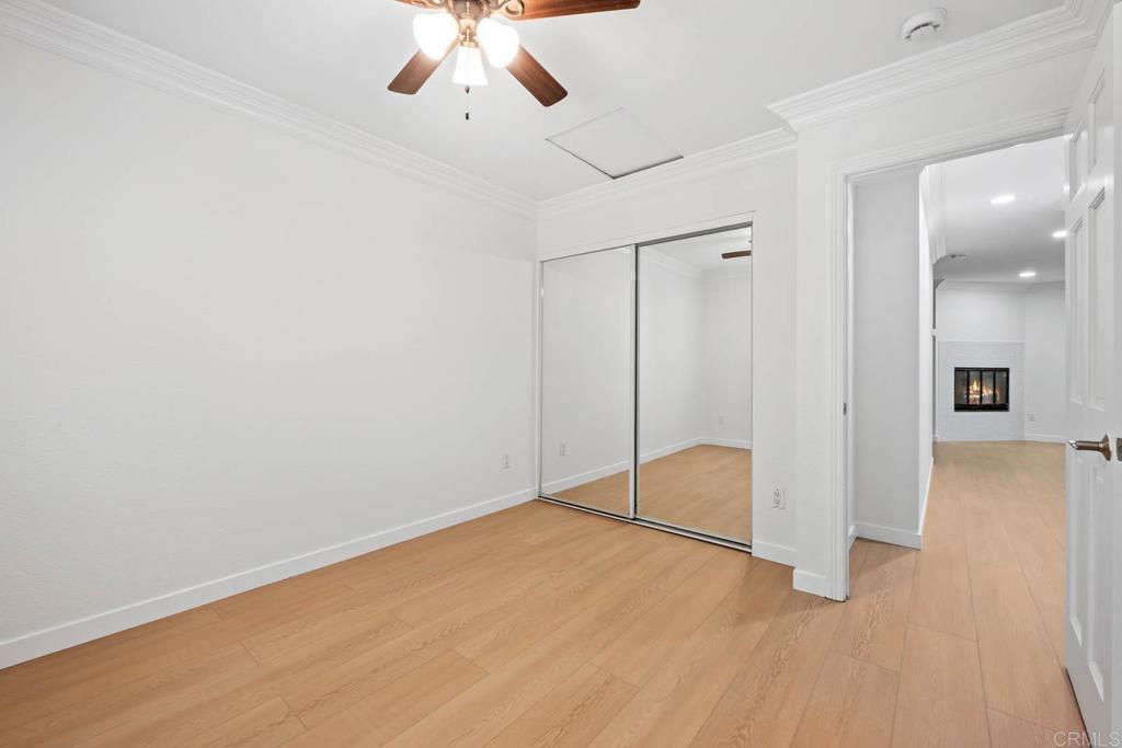 855 East Lexington Avenue, Unit 4 El Cajon, CA 92020 - Photo 6 of 12 an empty room with fan and entryway