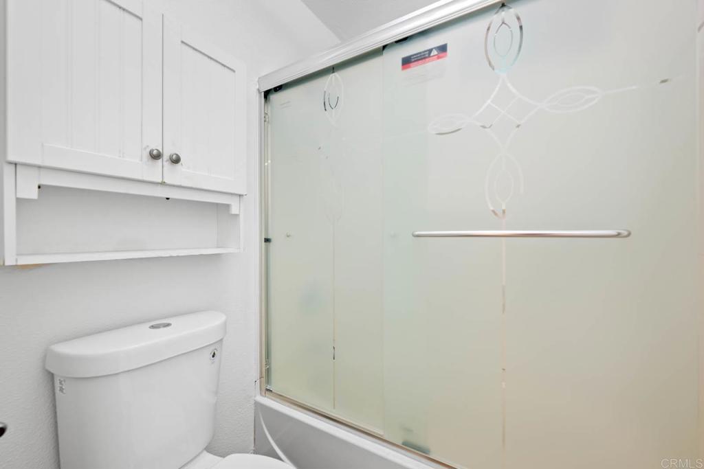 855 East Lexington Avenue, Unit 4 El Cajon, CA 92020 - Photo 9 of 12 a bathroom with a white toilet and a shower