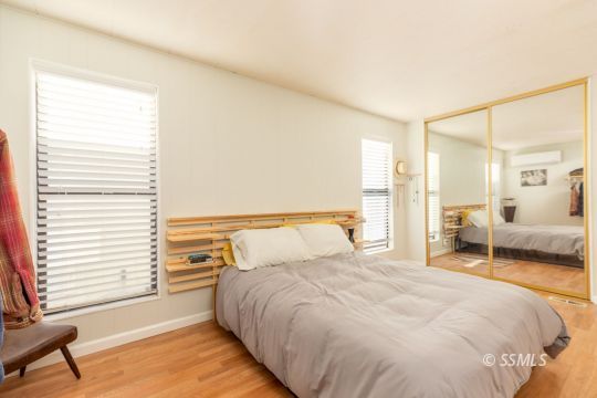1015 South Mahan Street Ridgecrest, CA 93555 - Photo 20 of 31 a bedroom with a large bed and a window