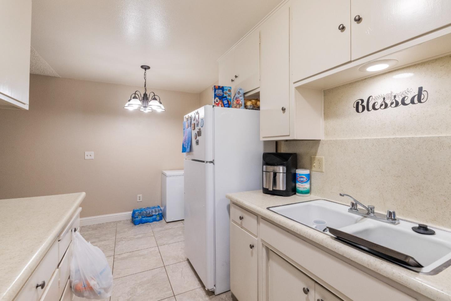 1317 East Rumble Road Modesto, CA 95355 - Photo 14 of 21 a kitchen with a sink and cabinets