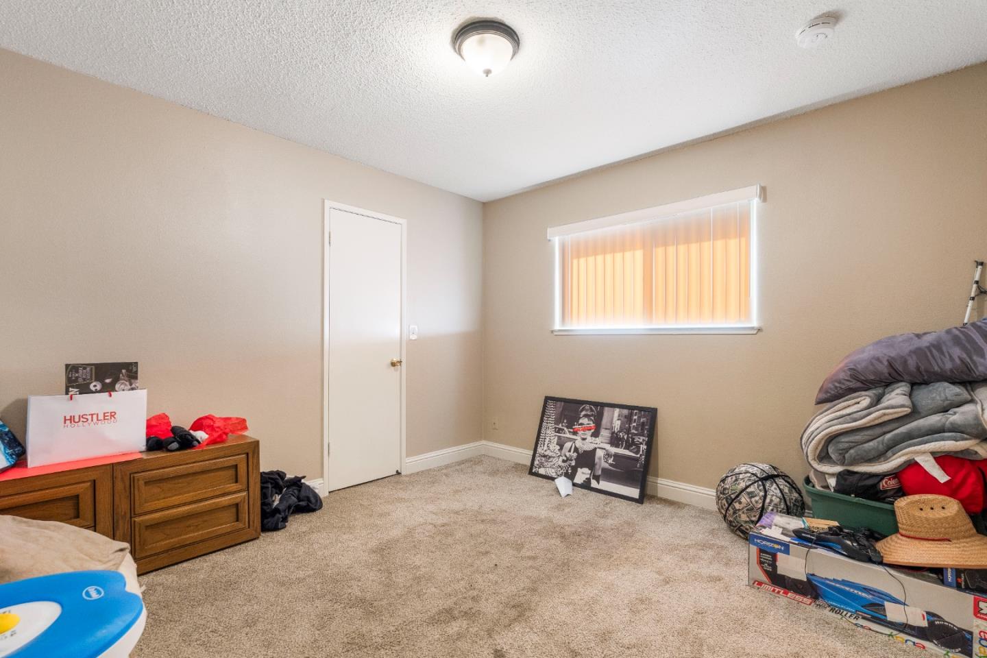 1317 East Rumble Road Modesto, CA 95355 - Photo 15 of 21 a bedroom with furniture and a window