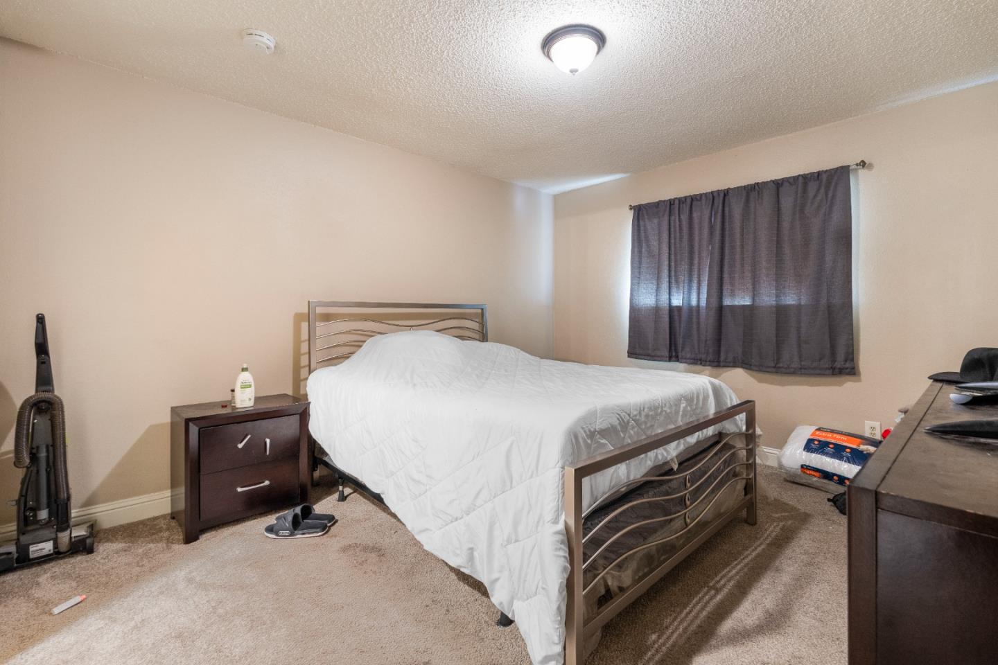 1317 East Rumble Road Modesto, CA 95355 - Photo 17 of 21 a bedroom with a bed and a tv