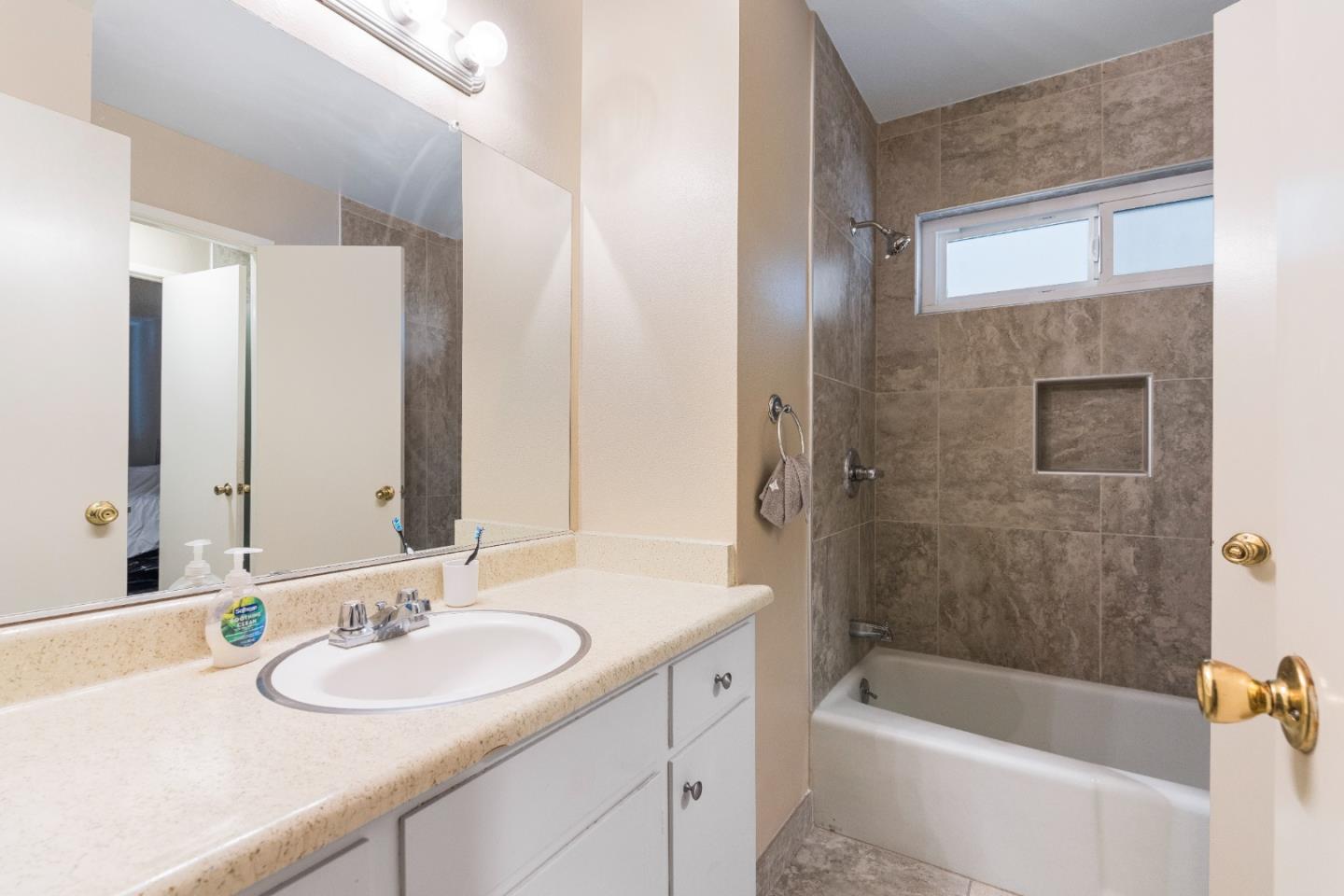 1317 East Rumble Road Modesto, CA 95355 - Photo 19 of 21 a bathroom with a sink and a bathtub