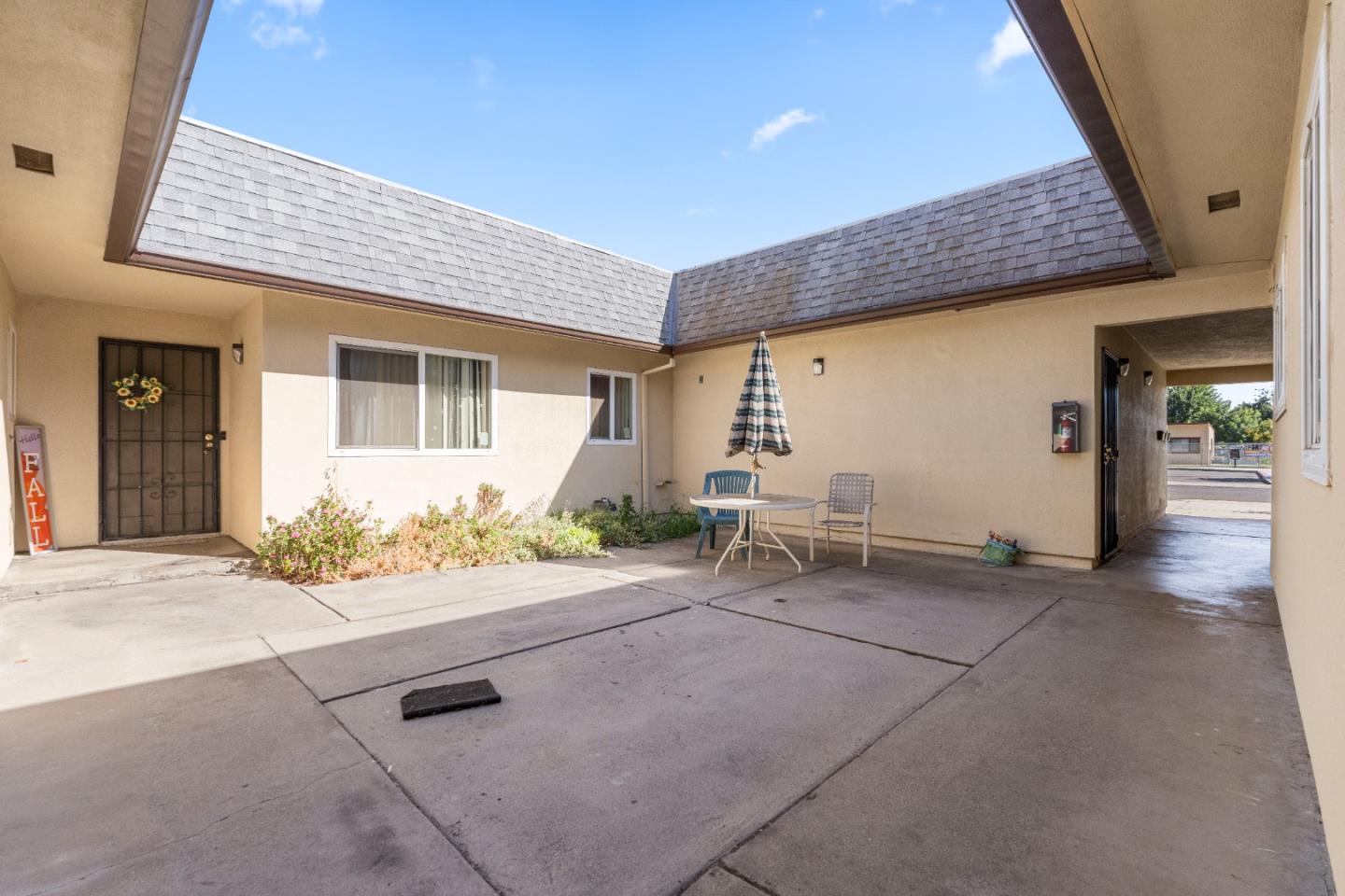 1317 East Rumble Road Modesto, CA 95355 - Photo 5 of 21 a backyard of a house with table and chairs
