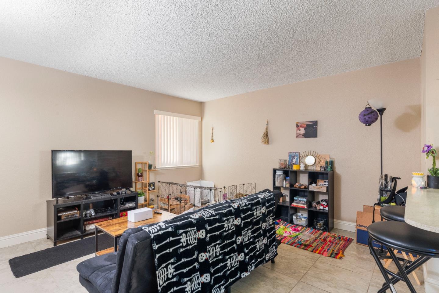 1317 East Rumble Road Modesto, CA 95355 - Photo 10 of 21 a living room with furniture and a flat screen tv