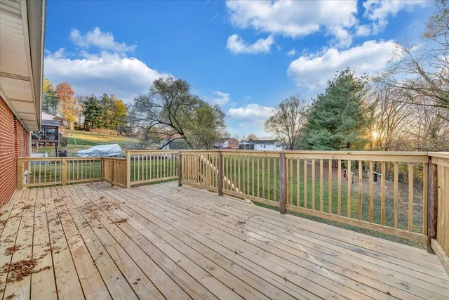 a view of a balcony with wooden floor