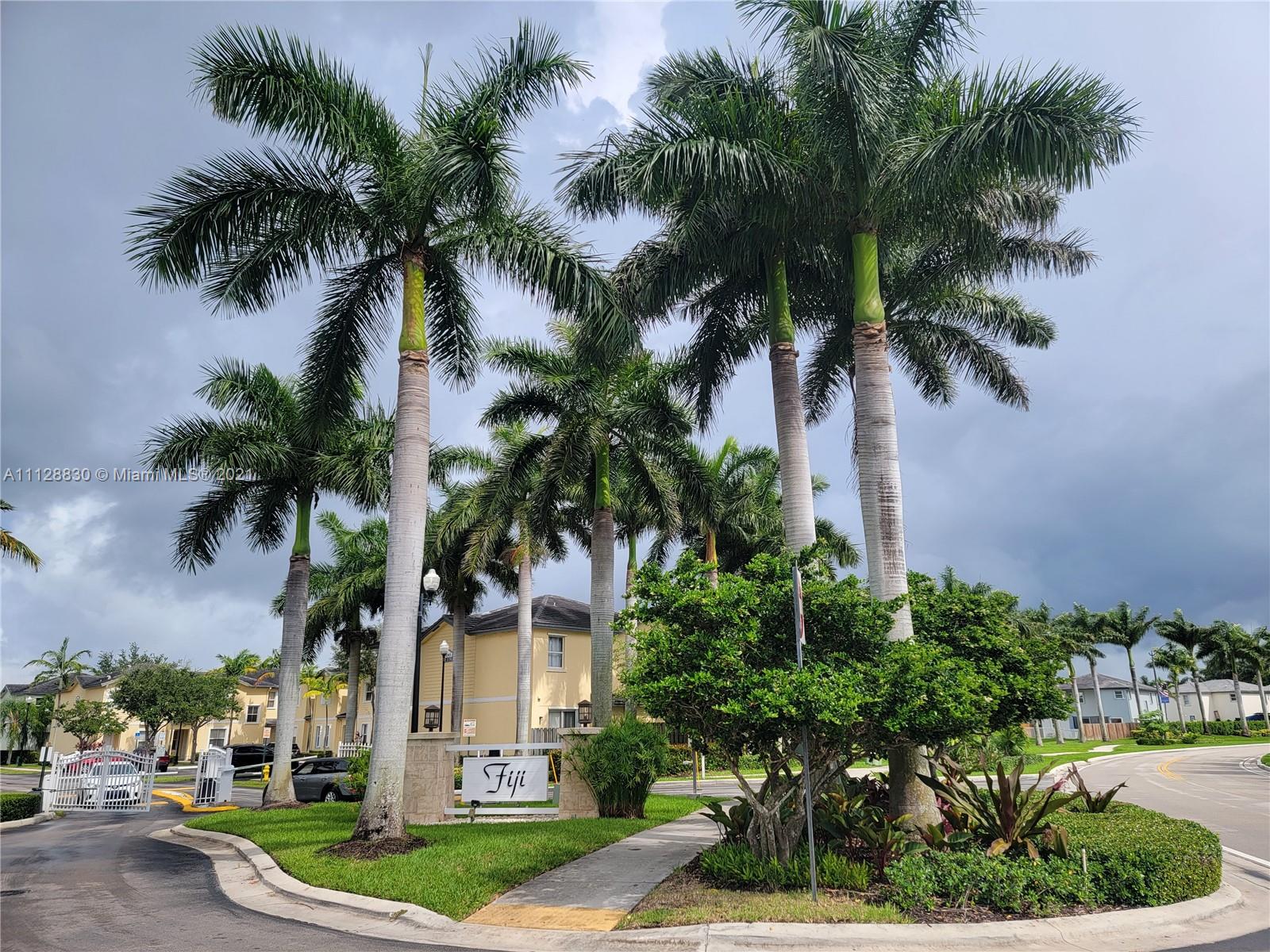 152 Southeast 29th Avenue, Unit 3 Homestead, FL 33033 - Photo 1 of 28 a view of a yard with a palm trees