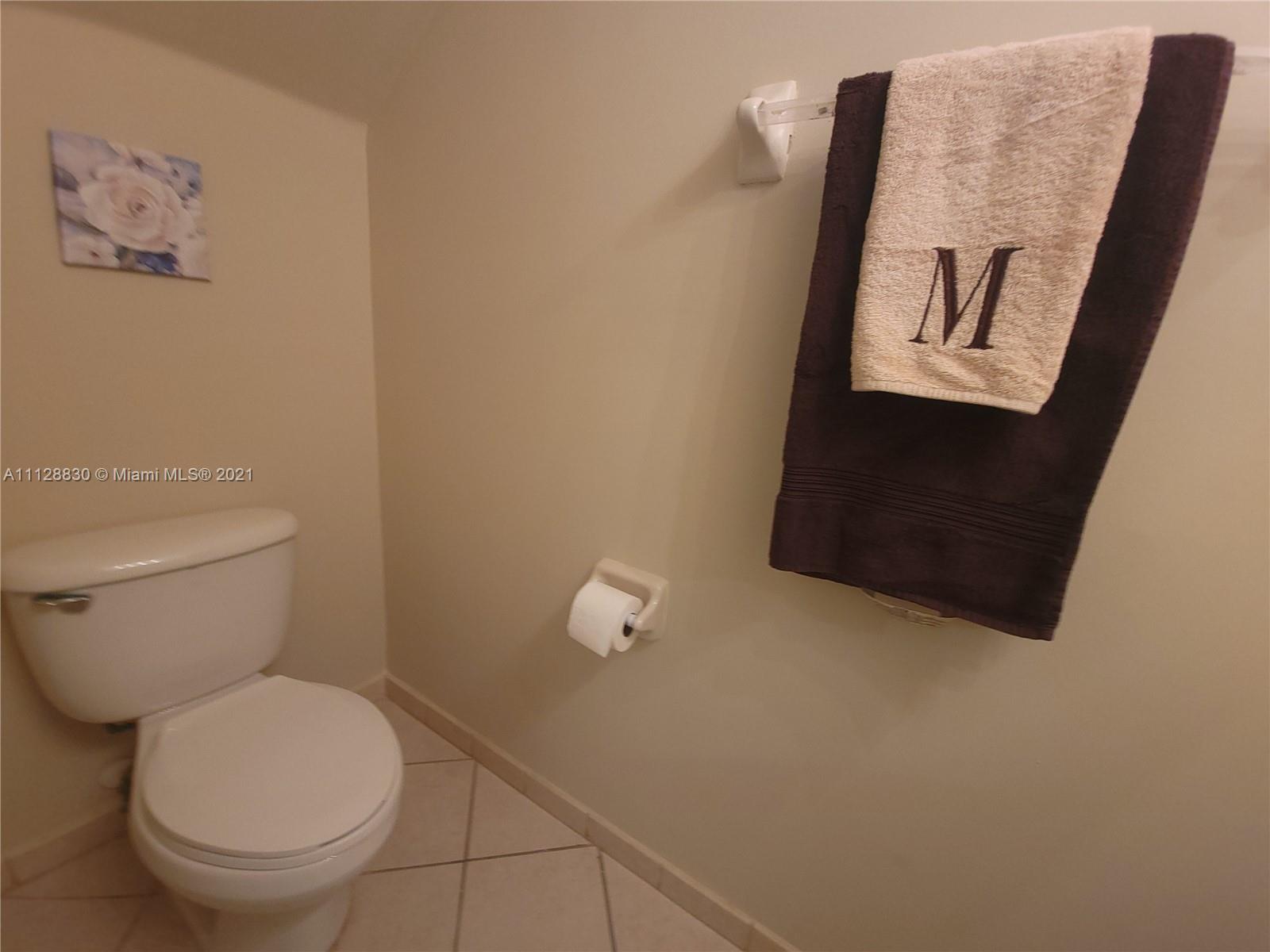 152 Southeast 29th Avenue, Unit 3 Homestead, FL 33033 - Photo 12 of 28 a white toilet sitting next to a shower