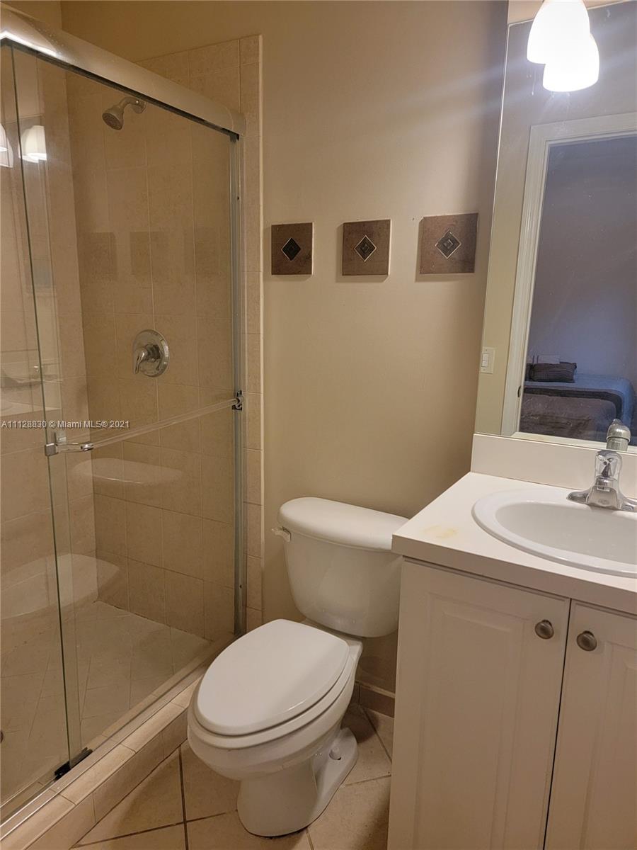 152 Southeast 29th Avenue, Unit 3 Homestead, FL 33033 - Photo 16 of 28 a bathroom with a sink a toilet and shower