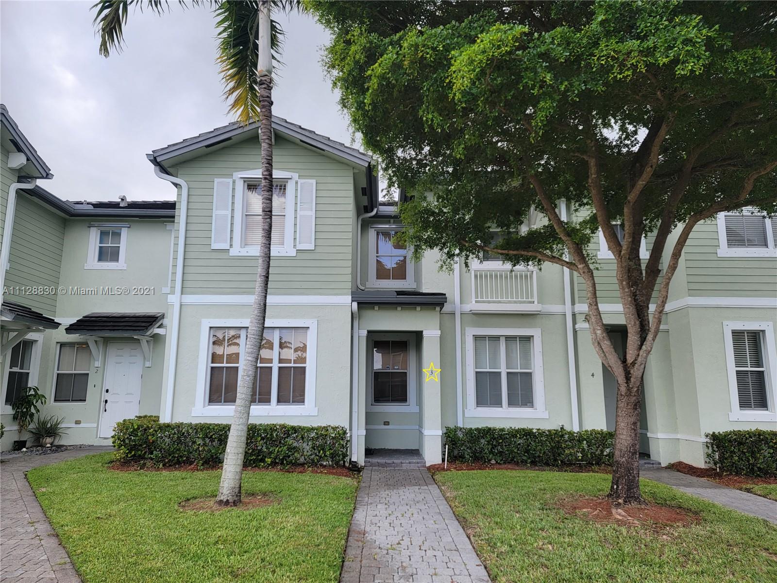 152 Southeast 29th Avenue, Unit 3 Homestead, FL 33033 - Photo 3 of 28 front view of a house with a yard