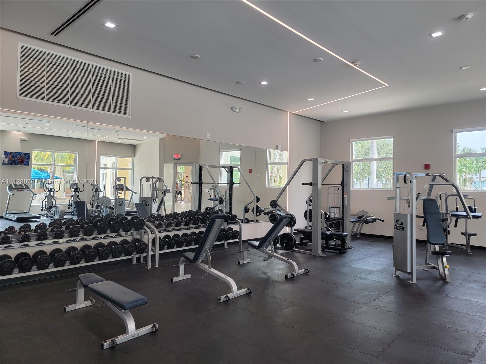 152 Southeast 29th Avenue, Unit 3 Homestead, FL 33033 - Photo 21 of 28 a view of a room with gym equipment