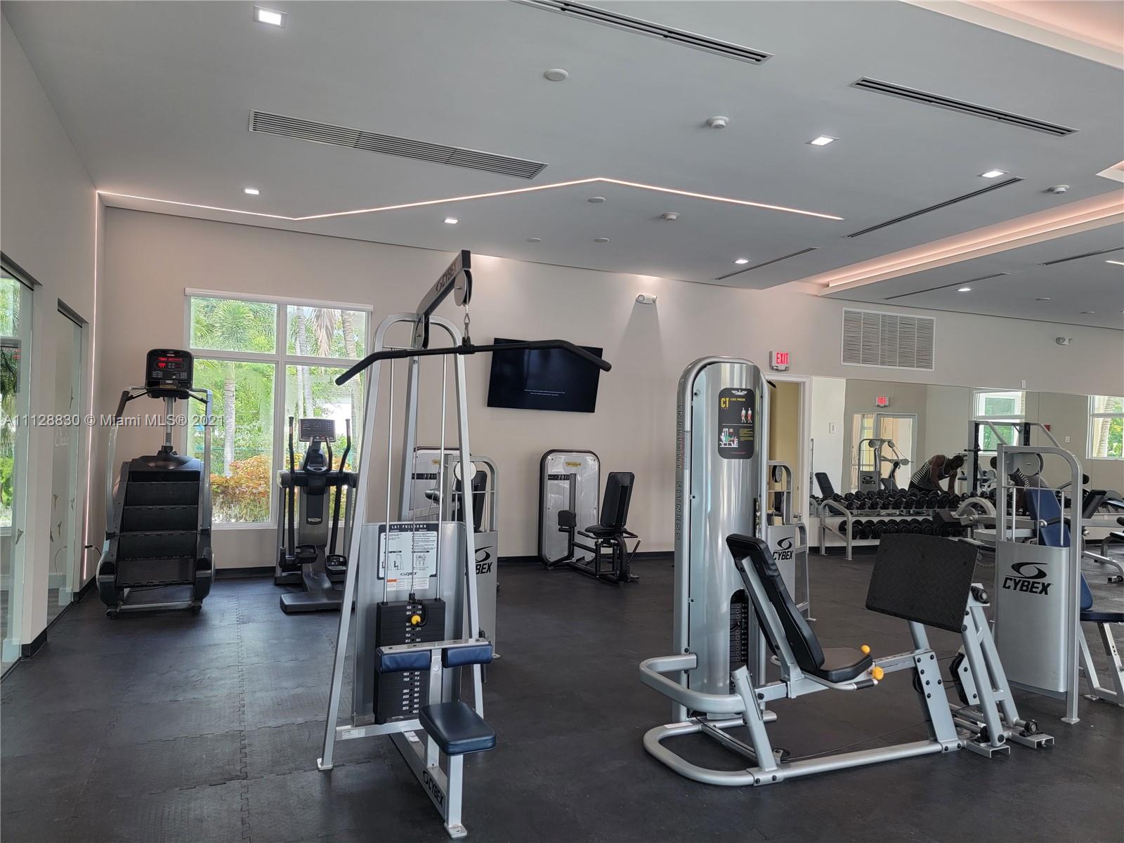 152 Southeast 29th Avenue, Unit 3 Homestead, FL 33033 - Photo 22 of 28 a view of a room with gym equipment