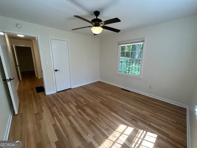 a view of an empty room with a window