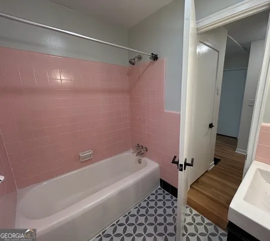 a bathroom with a bathtub and a shower