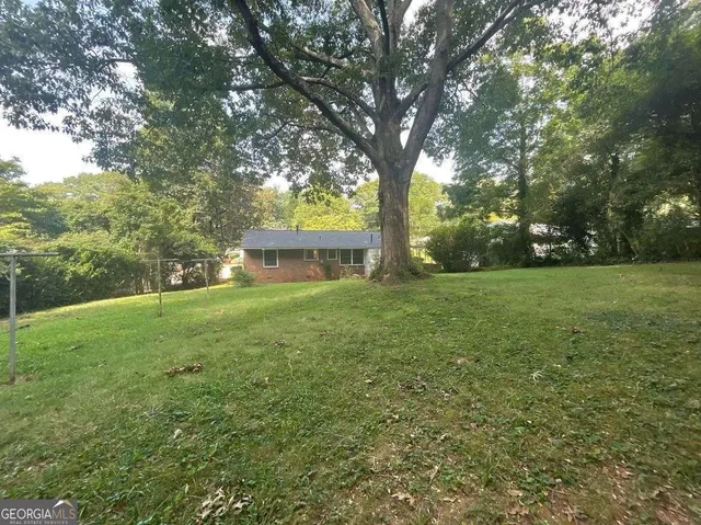 a view of a trees with a yard