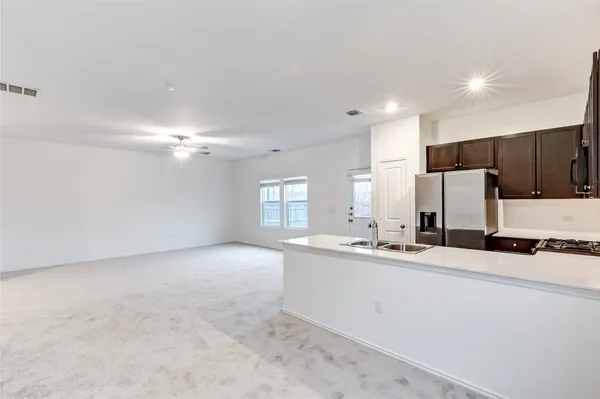 a kitchen with a refrigerator stove and microwave