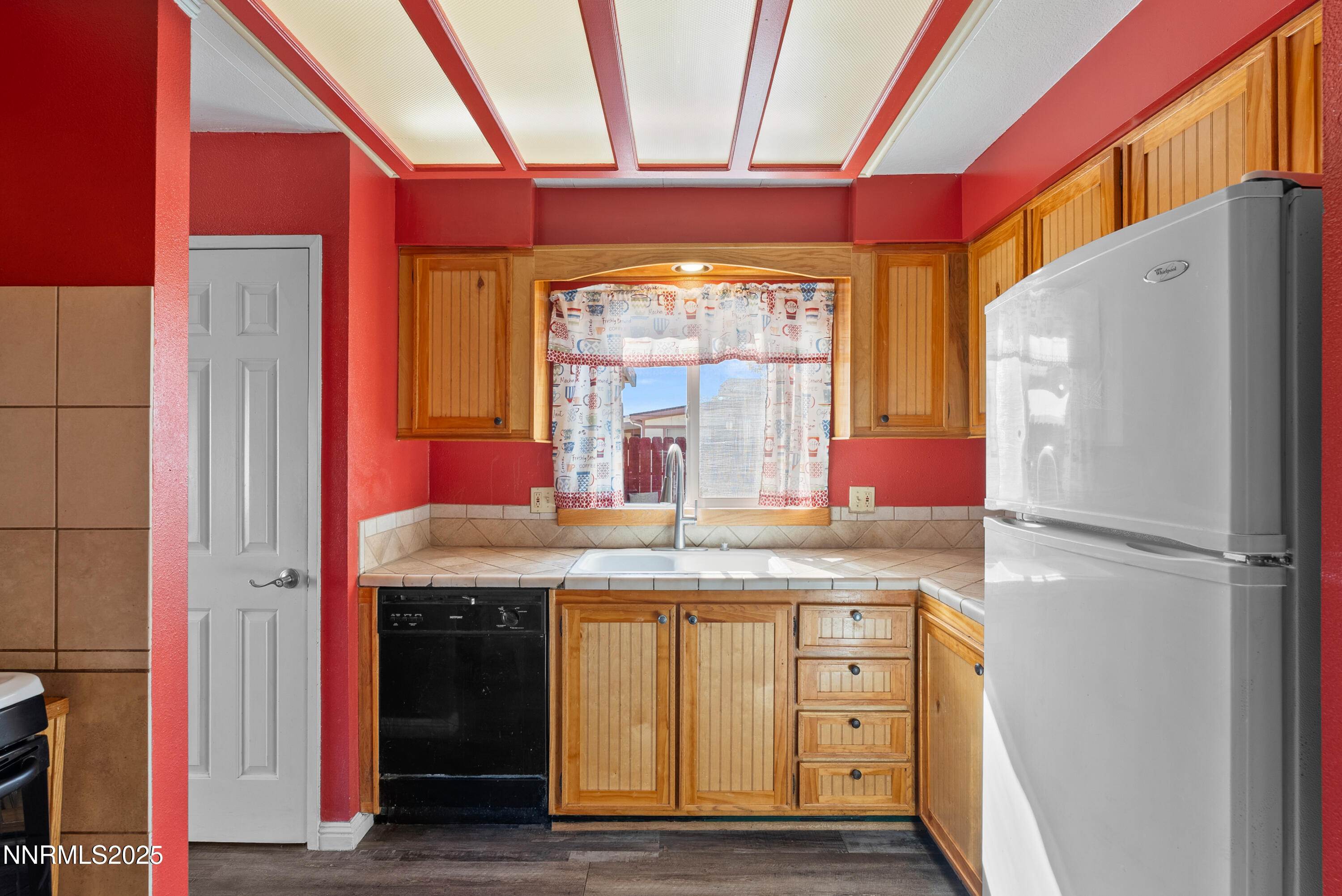 325 Parkland Way Fernley, NV 89408 - Photo 13 of 35 a kitchen with stainless steel appliances granite countertop a refrigerator and a sink