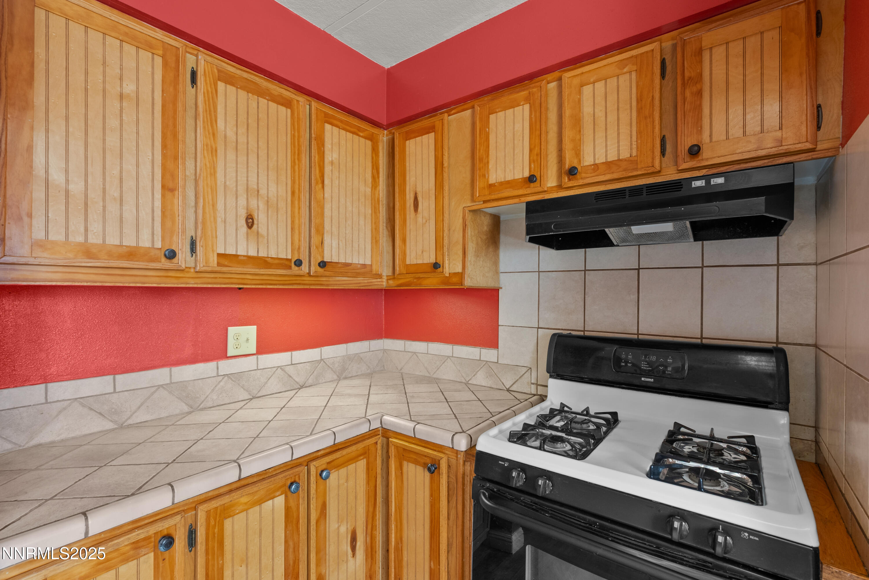 325 Parkland Way Fernley, NV 89408 - Photo 15 of 35 a kitchen with granite countertop cabinets and black appliances
