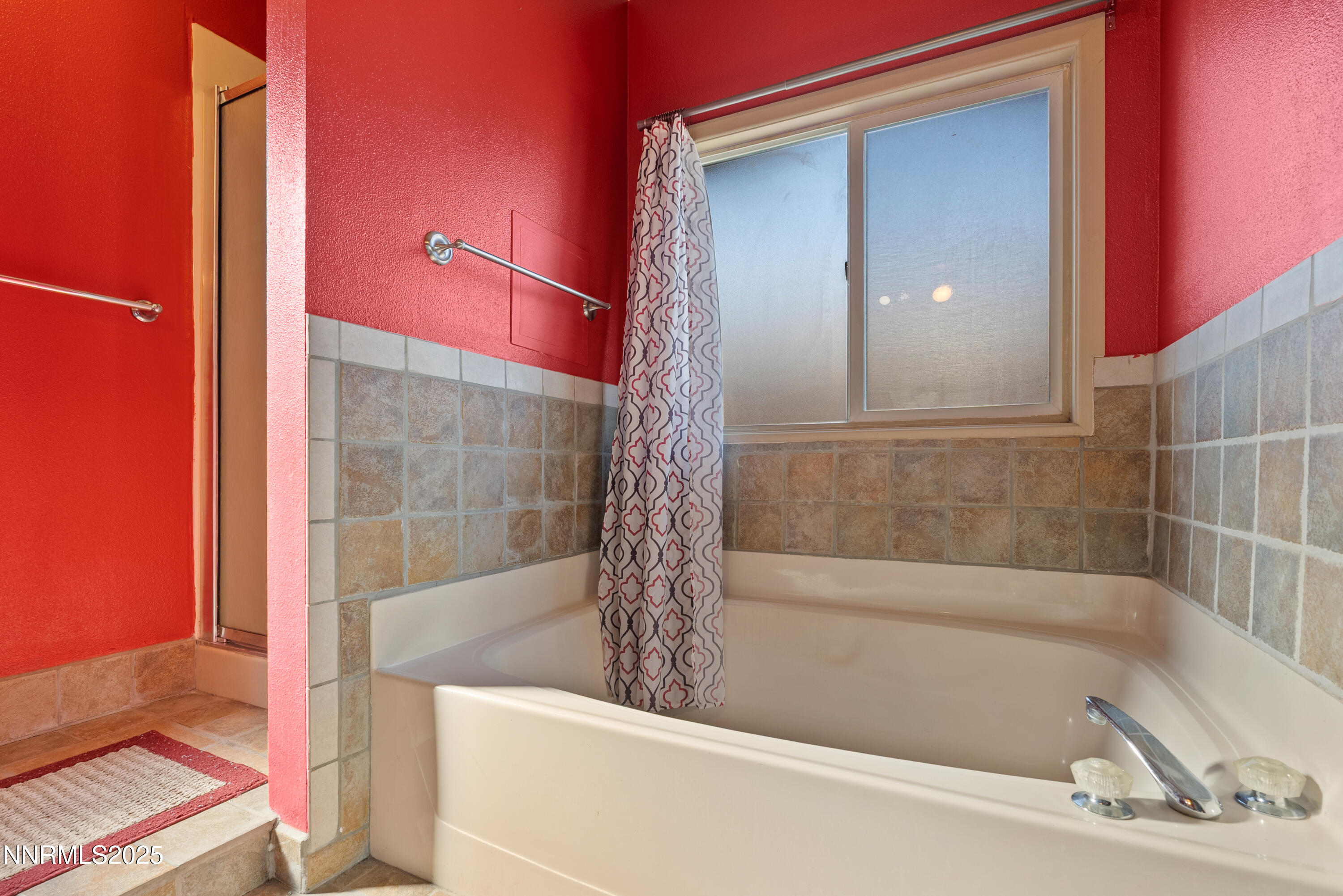 325 Parkland Way Fernley, NV 89408 - Photo 19 of 35 a bathroom with a bathtub and a shower