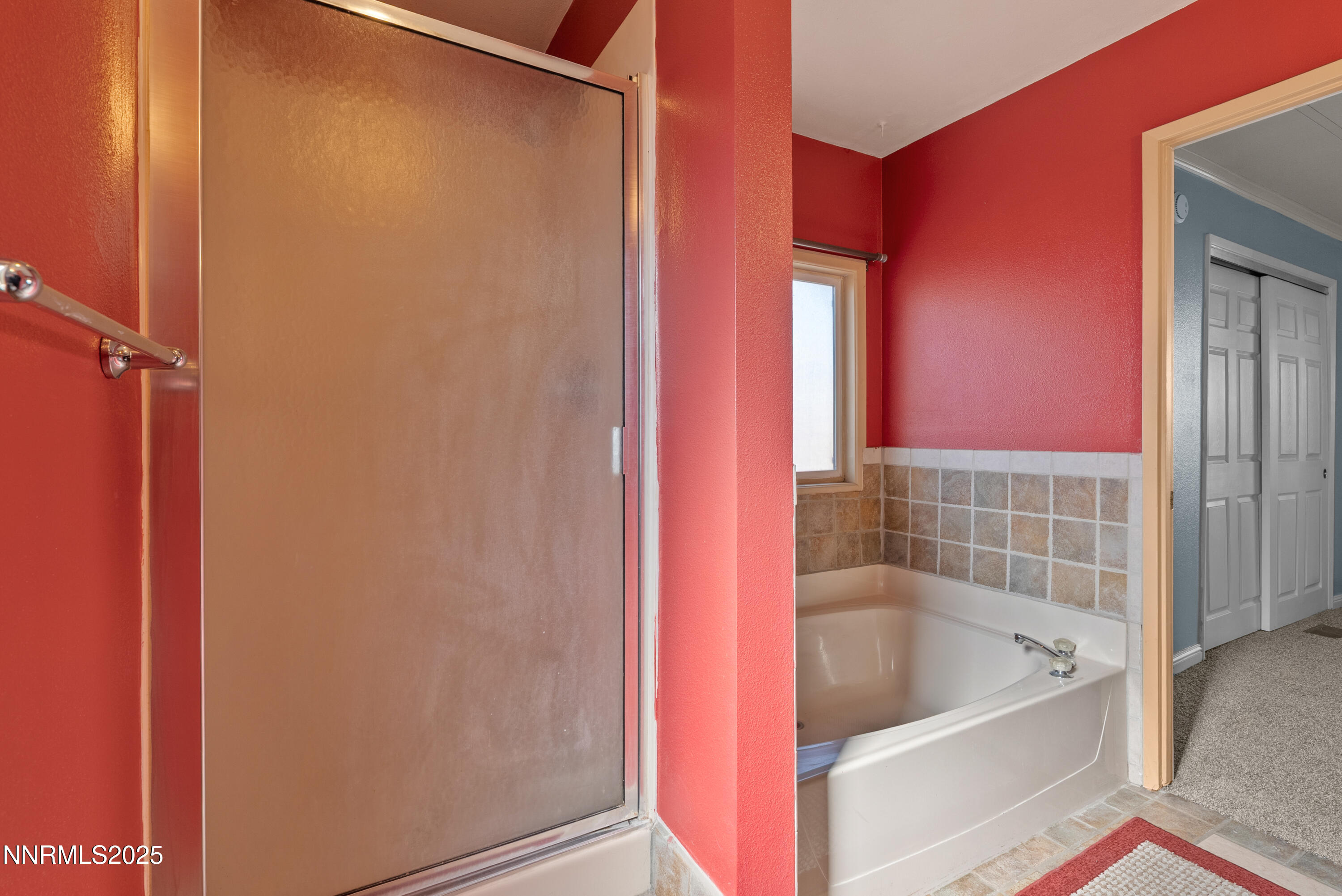 325 Parkland Way Fernley, NV 89408 - Photo 22 of 35 a bathroom with a tub shower and vanity