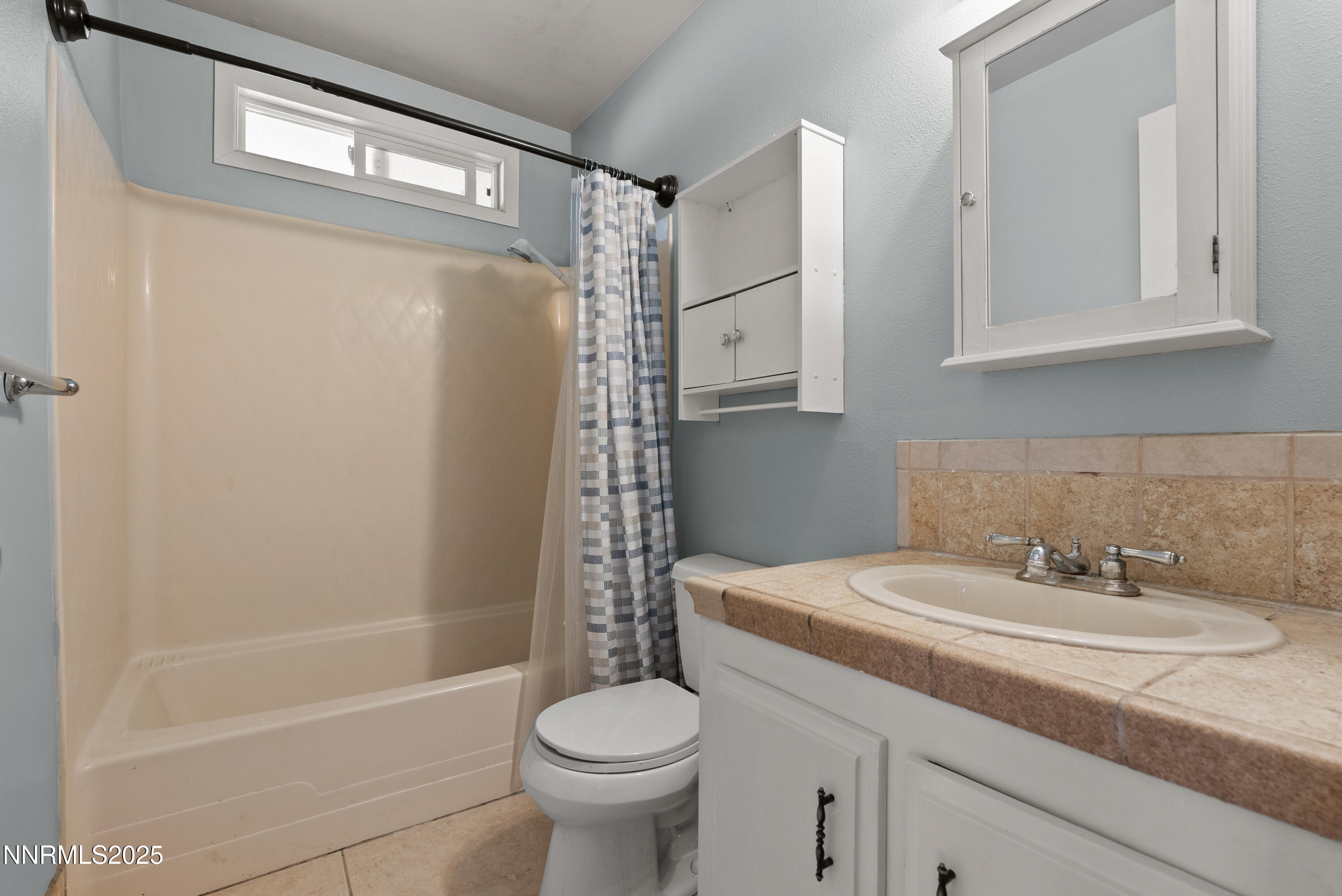 325 Parkland Way Fernley, NV 89408 - Photo 25 of 35 a bathroom with a sink a toilet and shower