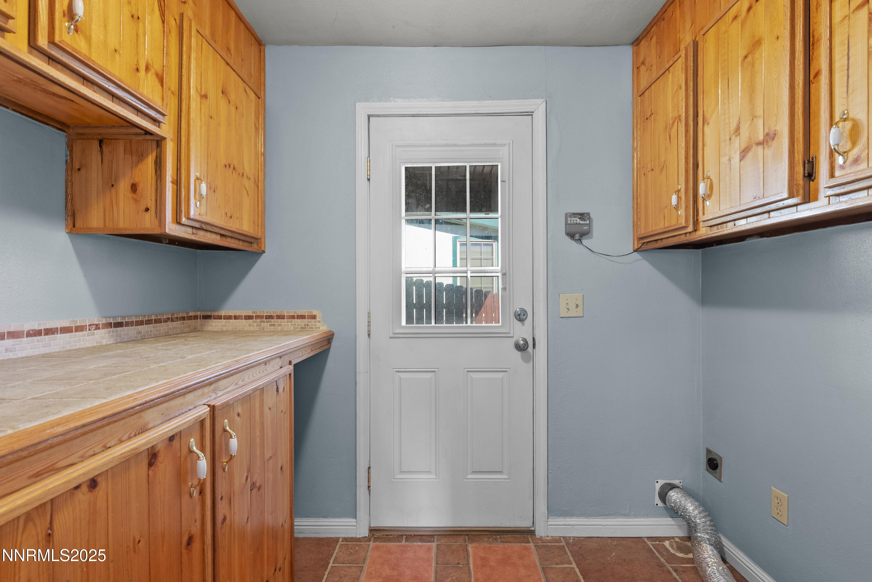 325 Parkland Way Fernley, NV 89408 - Photo 26 of 35 a kitchen with a window and cabinets