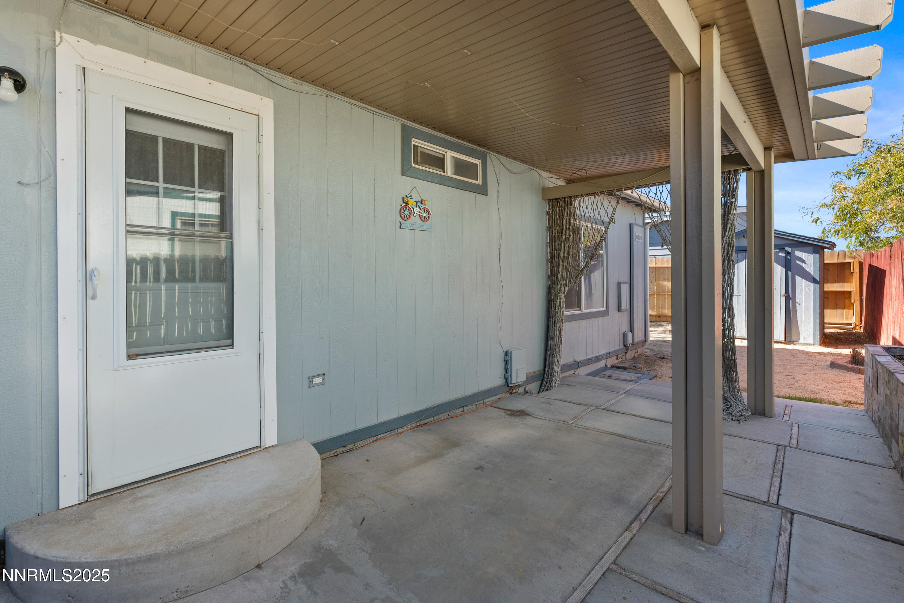 325 Parkland Way Fernley, NV 89408 - Photo 35 of 35 a view of a brick house with an outdoor space