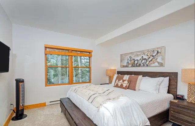 a living room with furniture fireplace and flat screen tv