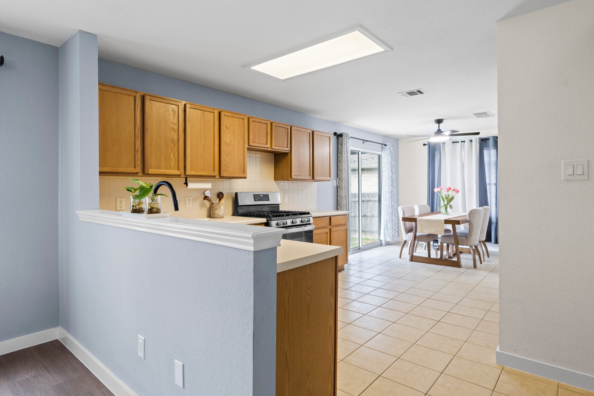 3811 Laurel Ridge Drive Round Rock, TX 78665 - Photo 13 of 35 a kitchen with a sink and a refrigerator