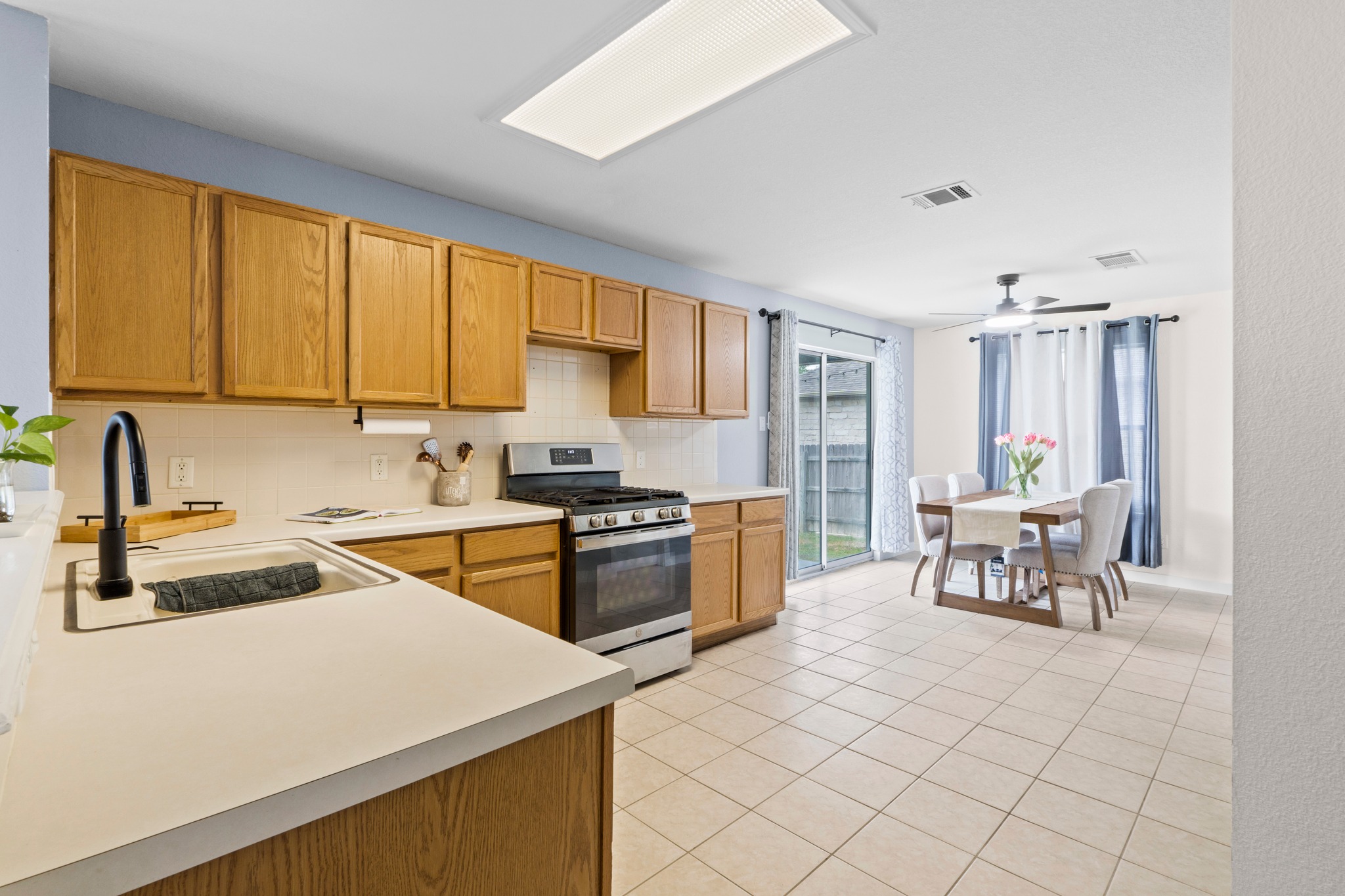 3811 Laurel Ridge Drive Round Rock, TX 78665 - Photo 14 of 35 a kitchen that has a sink and a stove in it