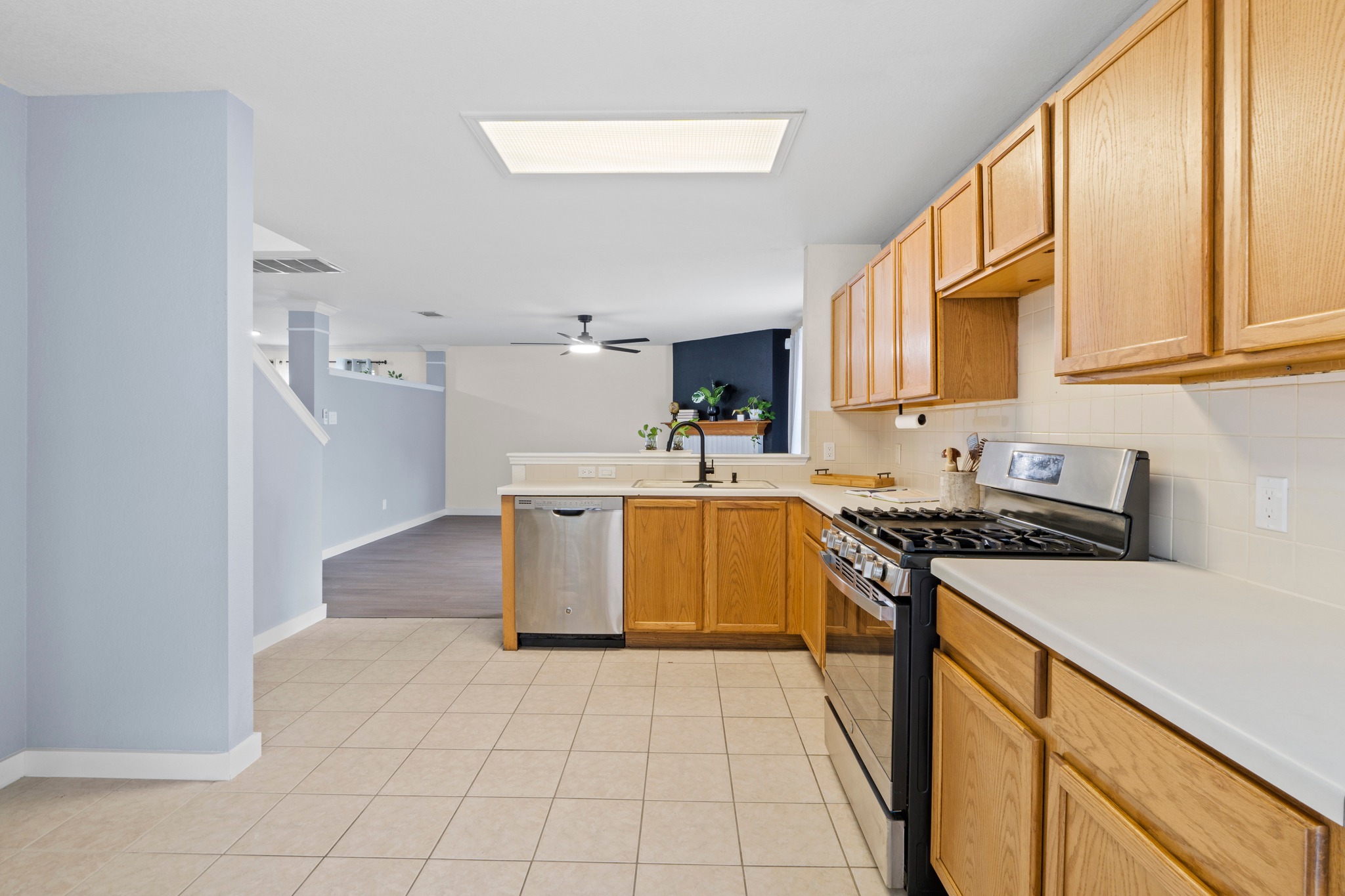 3811 Laurel Ridge Drive Round Rock, TX 78665 - Photo 16 of 35 a kitchen with a stove a sink and a refrigerator