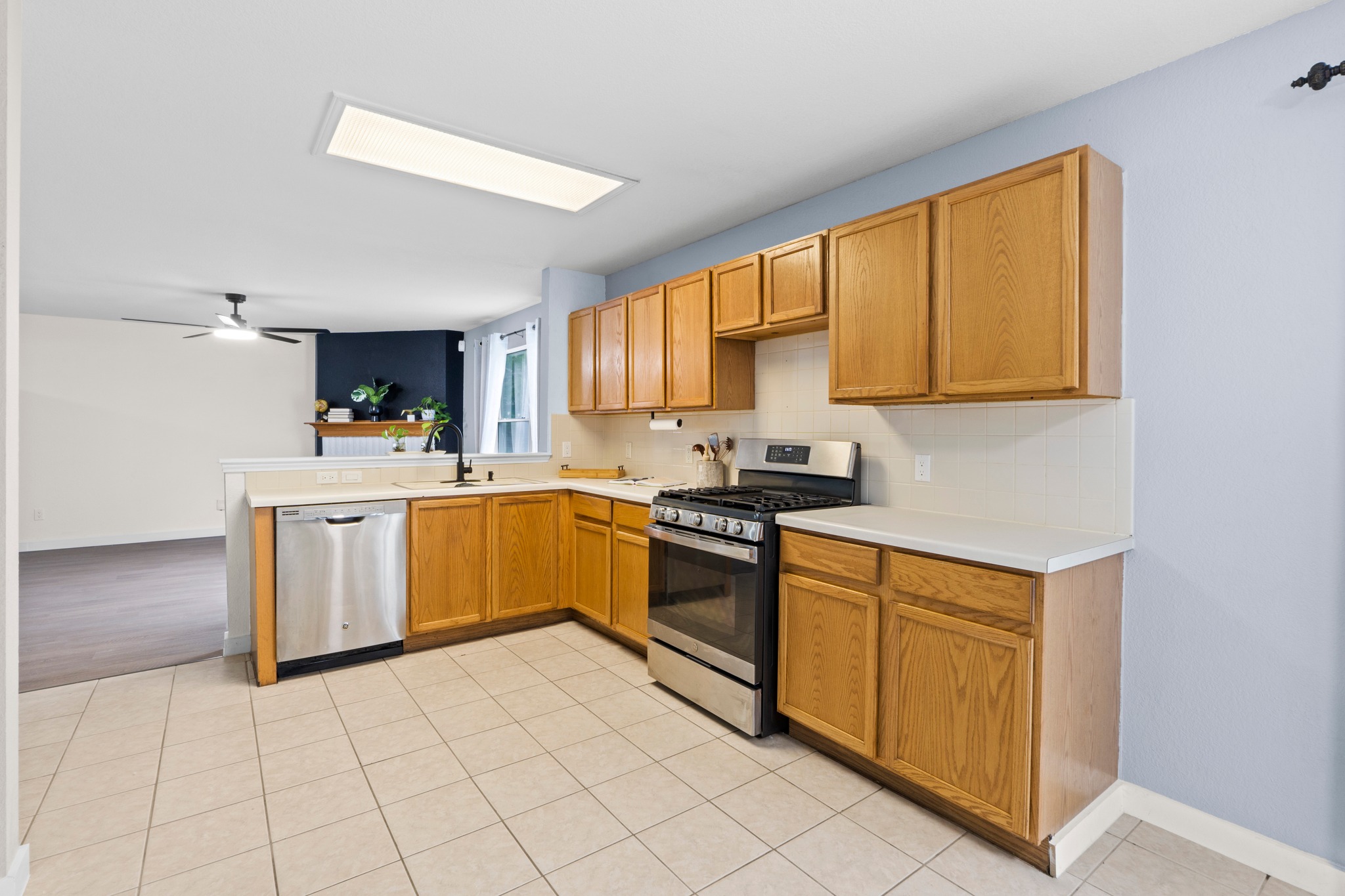 3811 Laurel Ridge Drive Round Rock, TX 78665 - Photo 17 of 35 a kitchen with a sink cabinets and window