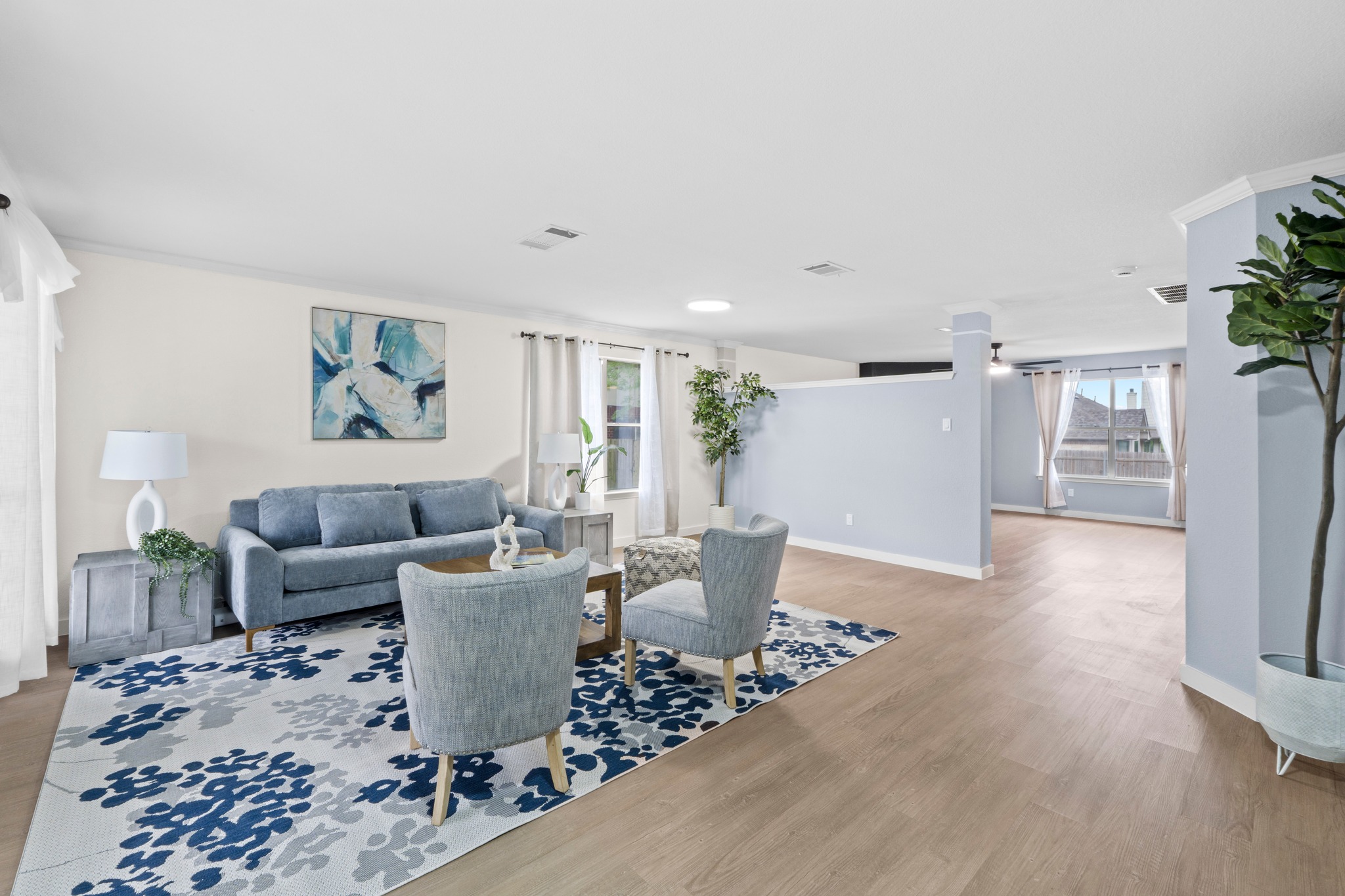 3811 Laurel Ridge Drive Round Rock, TX 78665 - Photo 2 of 35 a living room with furniture wooden floor and a potted plant