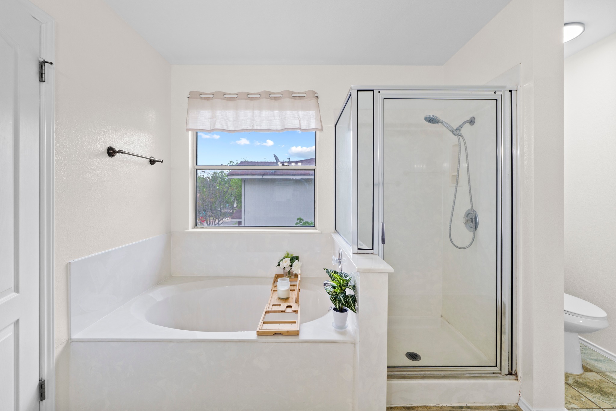 3811 Laurel Ridge Drive Round Rock, TX 78665 - Photo 24 of 35 a bathroom with a bathtub and a shower