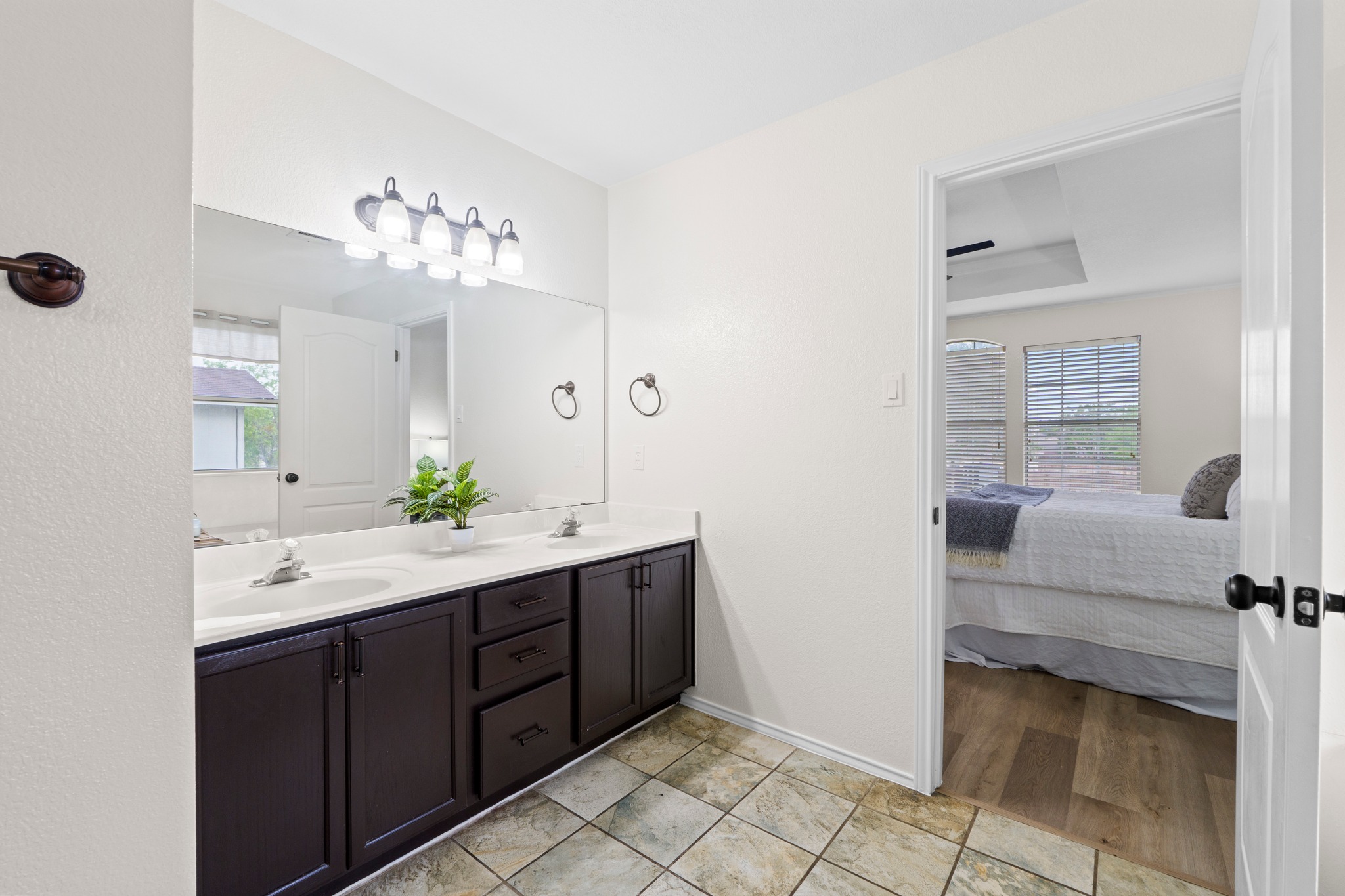3811 Laurel Ridge Drive Round Rock, TX 78665 - Photo 25 of 35 a spacious bathroom with a double vanity sink and a mirror