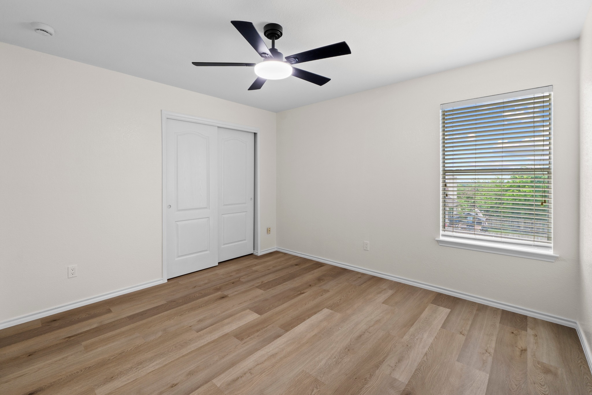 3811 Laurel Ridge Drive Round Rock, TX 78665 - Photo 29 of 35 wooden floor in an empty room with a window