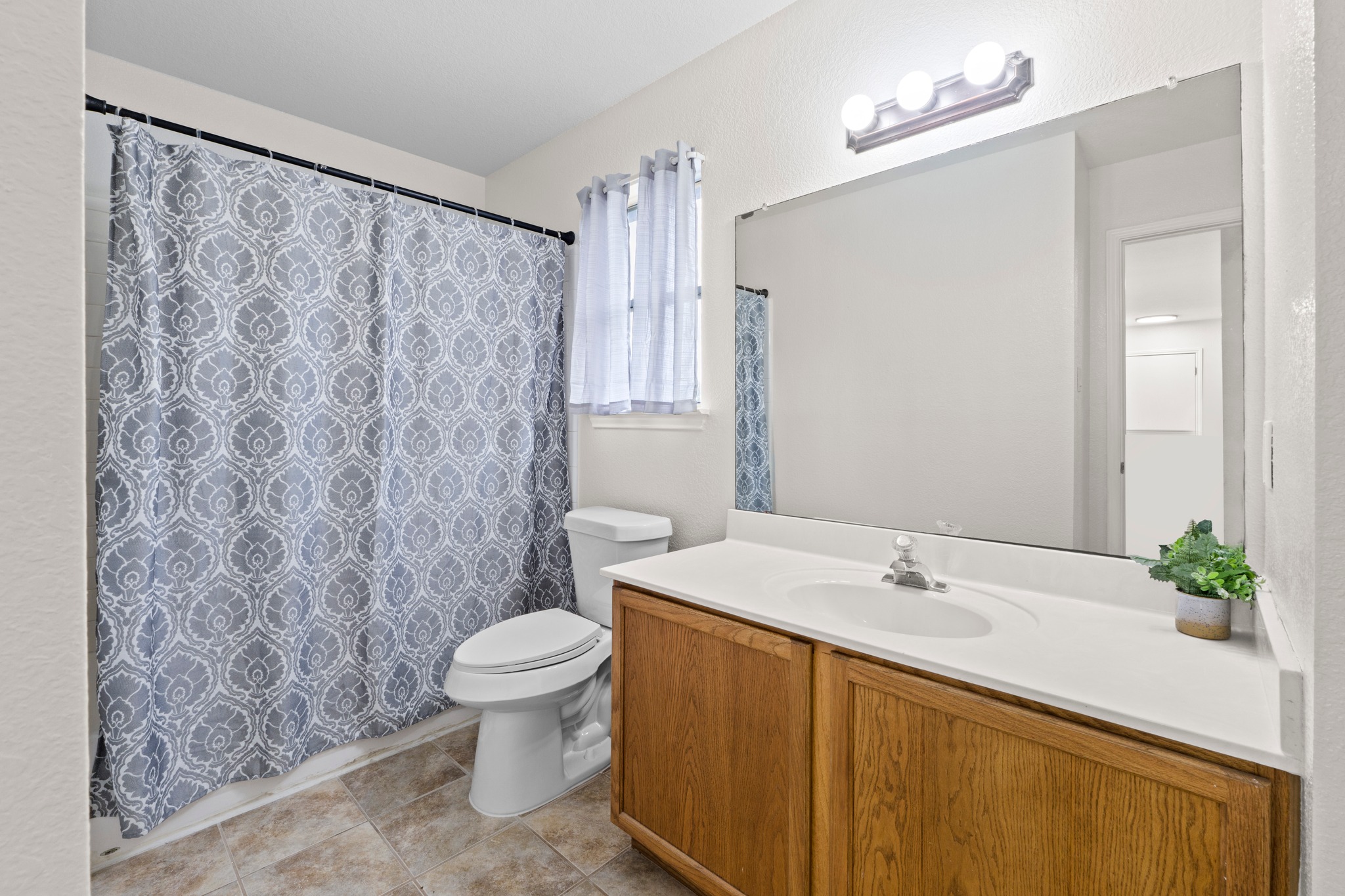 3811 Laurel Ridge Drive Round Rock, TX 78665 - Photo 30 of 35 a bathroom with a sink and a mirror