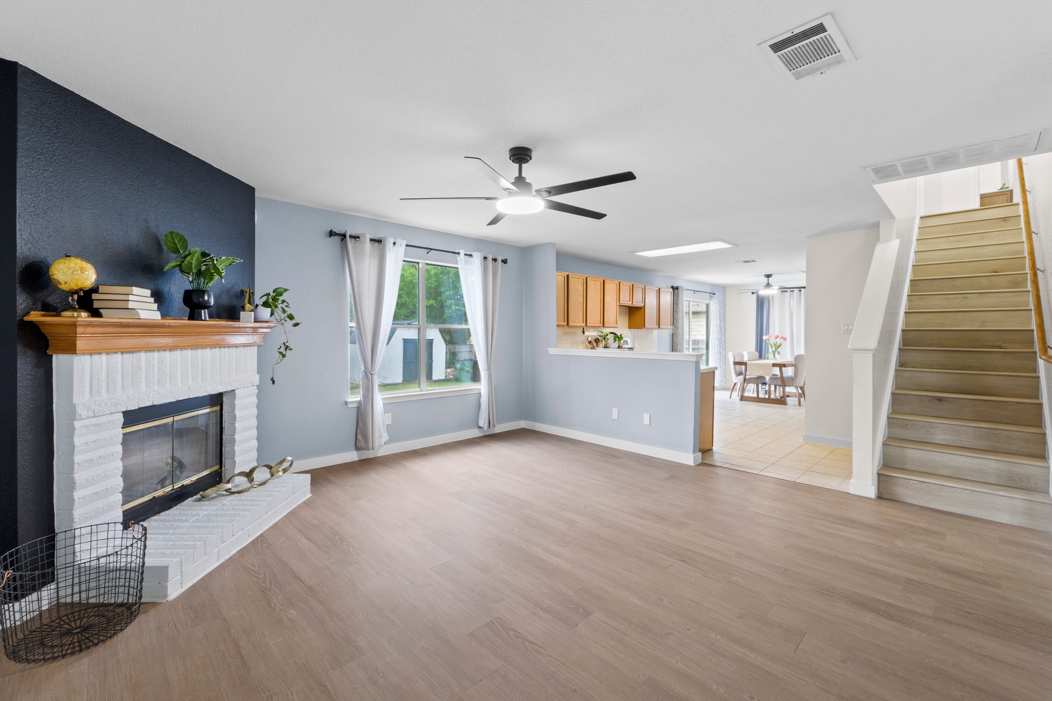 3811 Laurel Ridge Drive Round Rock, TX 78665 - Photo 3 of 35 a view of livingroom with hardwood floor and a fireplace