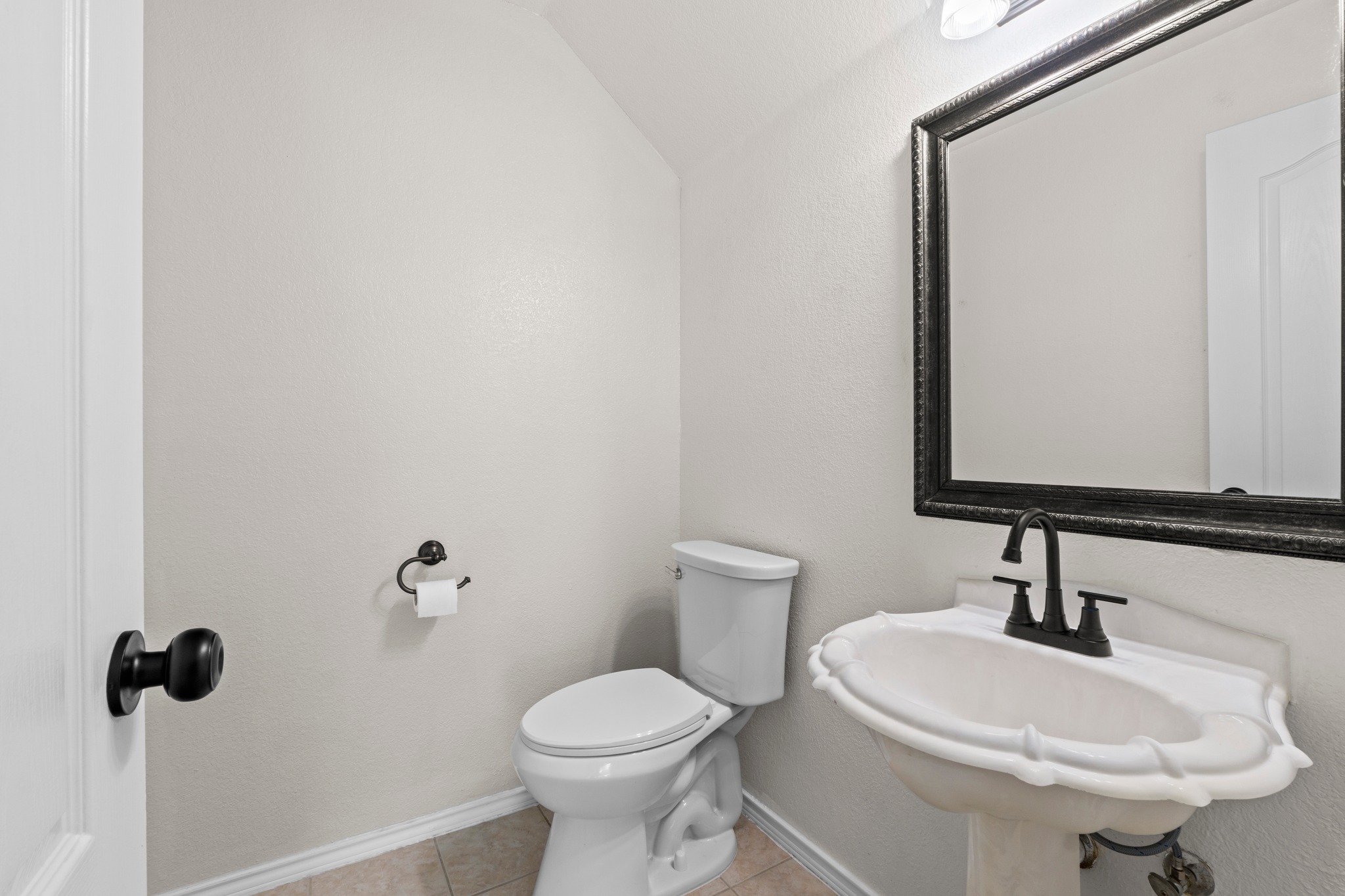 3811 Laurel Ridge Drive Round Rock, TX 78665 - Photo 31 of 35 a bathroom with a sink a toilet and mirror